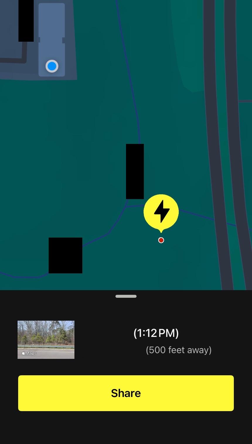 This image shows a map interface displaying a yellow circular icon with a black lightning bolt marker indicating where lightning struck approximately 500 feet away at 1:12pm. The teal-colored map features various roads and buildings, with a blue location dot marking the user's current position on one of the structures in the upper left corner. Some areas of the map have been redacted with black boxes. Below the map is a dark panel showing a small preview thumbnail of street view imagery from Apple Maps along with a large yellow button labeled Share at the bottom of the screen.
